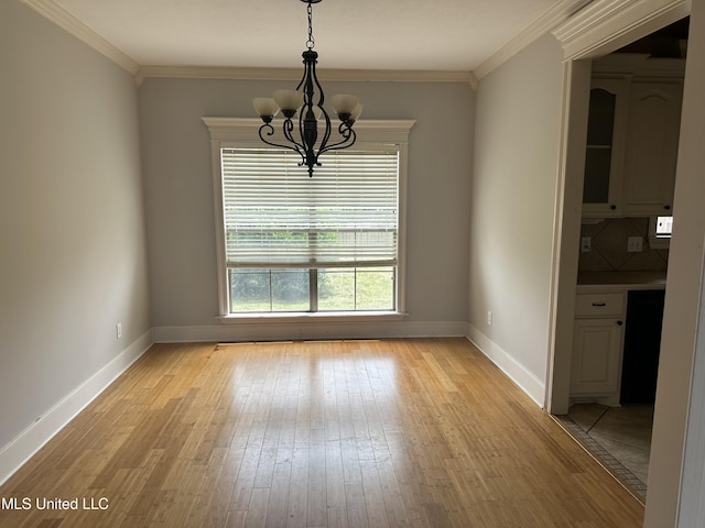 423 Grant Fox Dr, Brandon, MS 39047 - unfurnished dining area with a chandelier, light wood-style flooring, baseboards, and crown molding