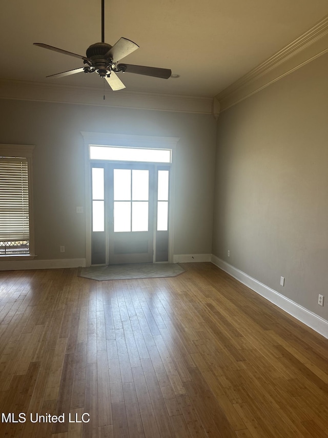 423 Grant Fox Dr, Brandon, MS 39047 - spare room featuring crown molding, a ceiling fan, hardwood / wood-style flooring, and baseboards