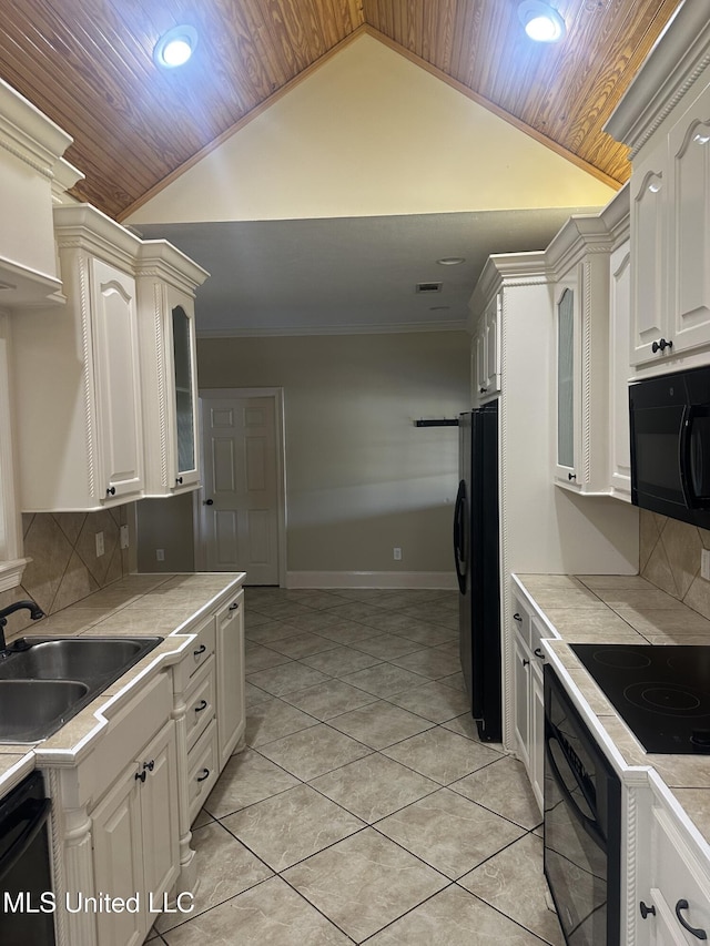 423 Grant Fox Dr, Brandon, MS 39047 - kitchen featuring black appliances, a sink, wooden ceiling, lofted ceiling, and decorative backsplash