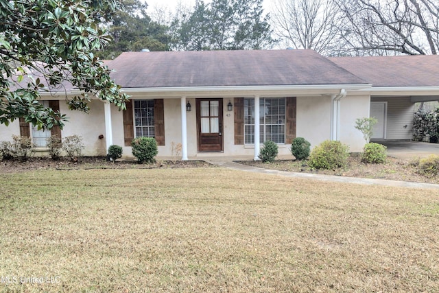 ranch-style house featuring a carport and a front yard