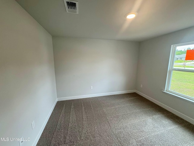 18052 Tiffany Renee Dr, Gulfport, MS 39503 - spare room with baseboards and dark carpet