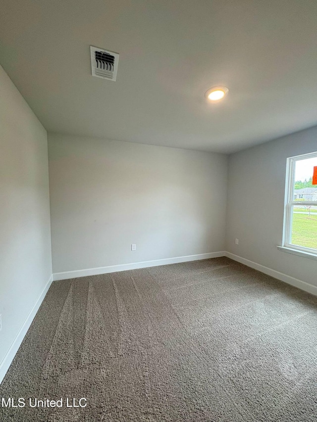 18052 Tiffany Renee Dr, Gulfport, MS 39503 - unfurnished room featuring baseboards and dark colored carpet