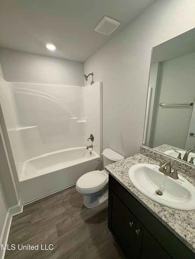 18052 Tiffany Renee Dr, Gulfport, MS 39503 - full bathroom with vanity, toilet, shower / bath combination, and wood finished floors