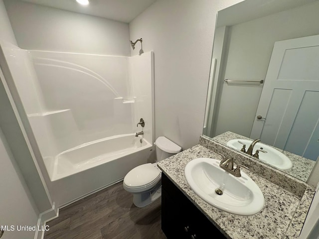 18052 Tiffany Renee Dr, Gulfport, MS 39503 - full bath featuring vanity, toilet, shower / washtub combination, and wood finished floors