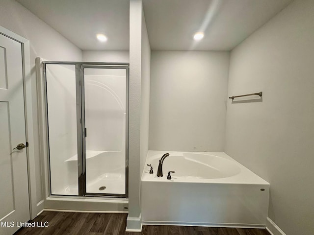 18052 Tiffany Renee Dr, Gulfport, MS 39503 - bathroom with wood finished floors, a stall shower, and a bath