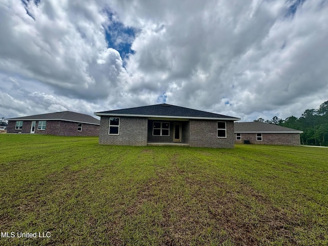 18052 Tiffany Renee Dr, Gulfport, MS 39503 - back of property with a yard and brick siding
