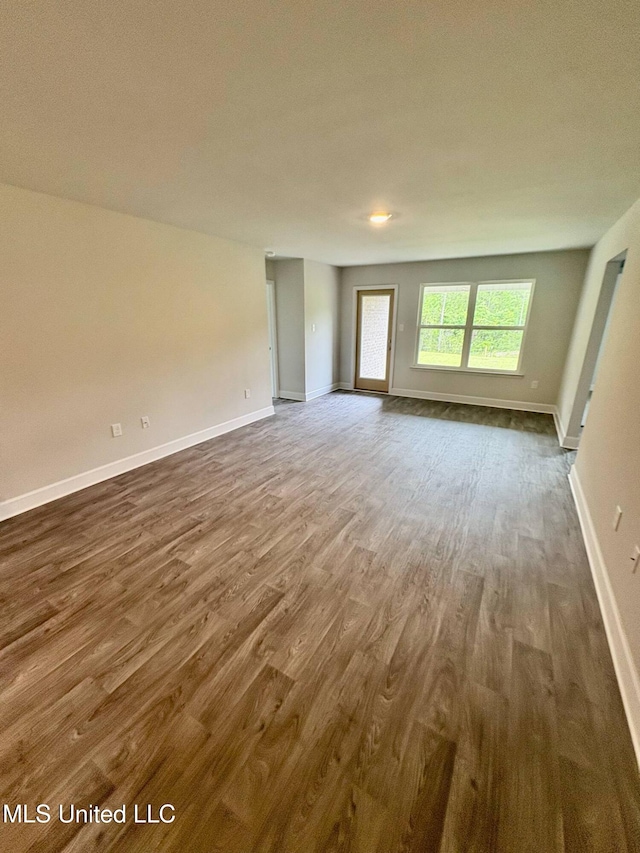 18052 Tiffany Renee Dr, Gulfport, MS 39503 - empty room featuring dark wood finished floors and baseboards