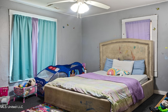 carpeted bedroom featuring ceiling fan