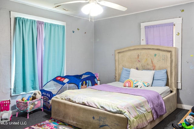 carpeted bedroom featuring a ceiling fan