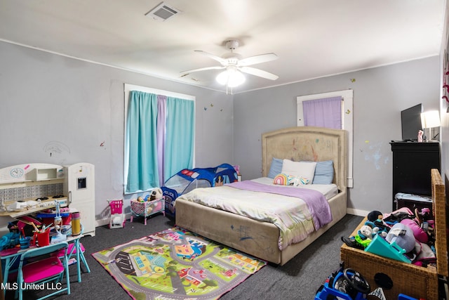 bedroom with carpet, a ceiling fan, and visible vents