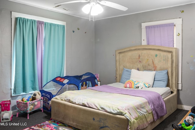 carpeted bedroom featuring ceiling fan
