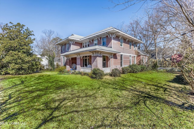 view of front of house with a porch and a front lawn