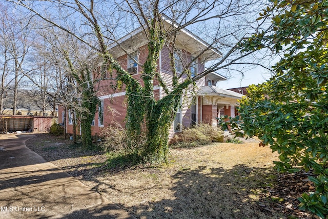 view of property exterior featuring fence