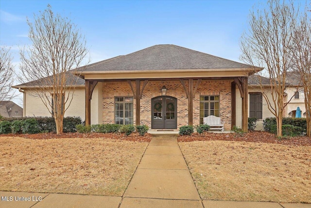 view of front of property featuring french doors and a porch