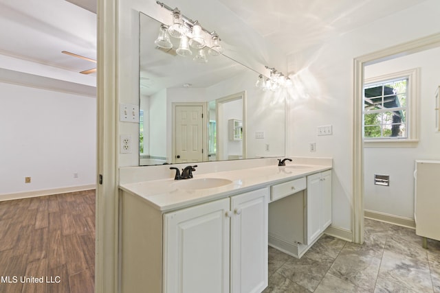 7635 Fairway Dr, Diamondhead, MS 39525 - full bathroom with double vanity and baseboards