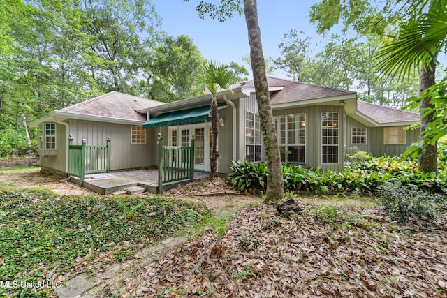7635 Fairway Dr, Diamondhead, MS 39525 - rear view of property with roof with shingles