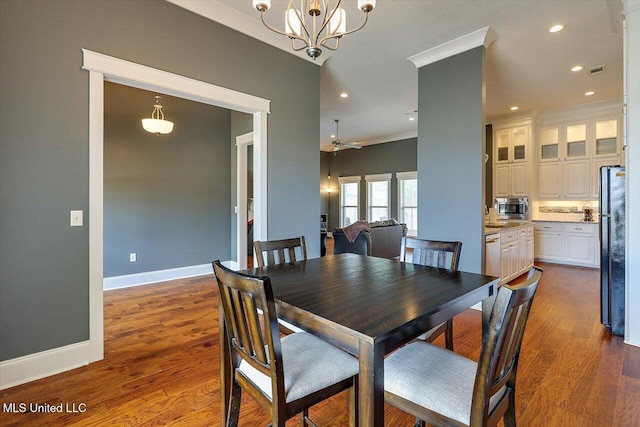 244 Hidden Hills Pkwy, Brandon, MS 39047 - dining space featuring recessed lighting, crown molding, a chandelier, dark wood-style flooring, and ceiling fan