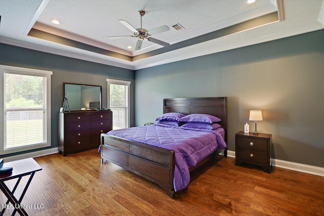 244 Hidden Hills Pkwy, Brandon, MS 39047 - bedroom with a raised ceiling, wood finished floors, recessed lighting, and a ceiling fan