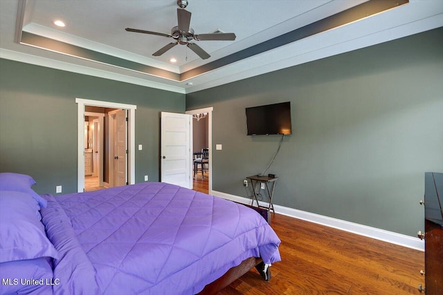 244 Hidden Hills Pkwy, Brandon, MS 39047 - bedroom featuring a tray ceiling, recessed lighting, wood finished floors, a ceiling fan, and crown molding