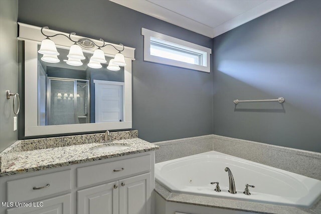244 Hidden Hills Pkwy, Brandon, MS 39047 - bathroom featuring a jetted tub, vanity, and a shower stall