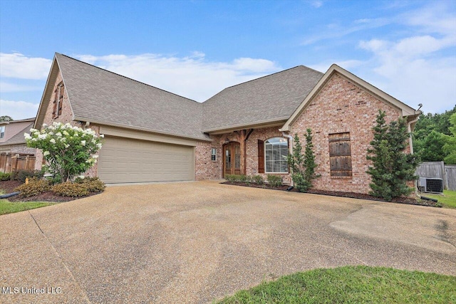 244 Hidden Hills Pkwy, Brandon, MS 39047 - view of front of house with concrete driveway, a garage, roof with shingles, and brick siding
