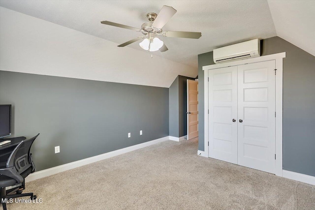 244 Hidden Hills Pkwy, Brandon, MS 39047 - unfurnished office with an AC wall unit, vaulted ceiling, carpet floors, and a ceiling fan