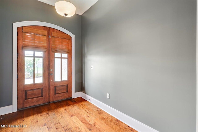244 Hidden Hills Pkwy, Brandon, MS 39047 - entrance foyer with french doors, light wood-type flooring, and arched walkways