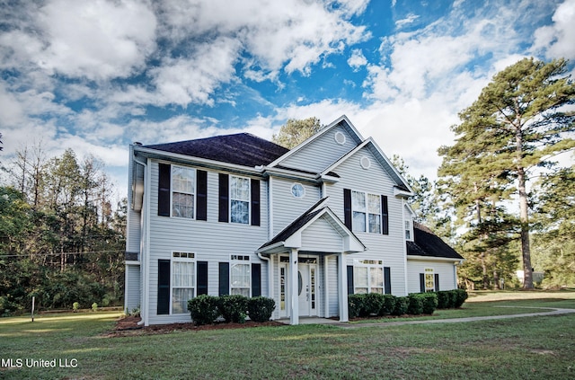 view of front facade with french doors and a front yard