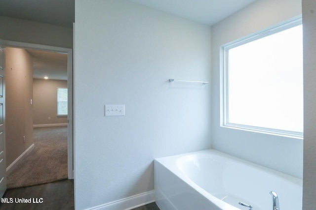 bathroom with a tub