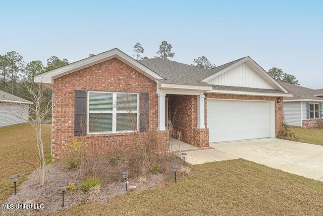 view of front of property with a front lawn and a garage