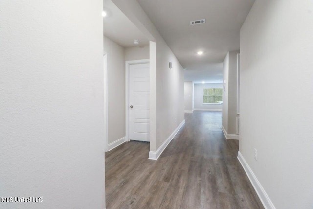 hallway featuring dark hardwood / wood-style floors