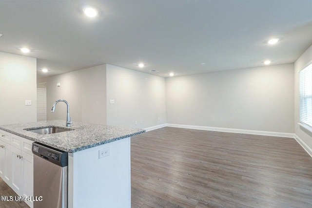 kitchen featuring white cabinetry, sink, stainless steel dishwasher, dark hardwood / wood-style floors, and a center island with sink