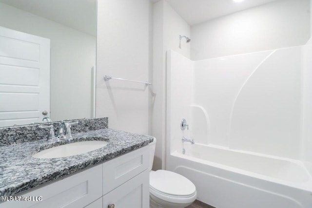 full bathroom with bathing tub / shower combination, vanity, and toilet