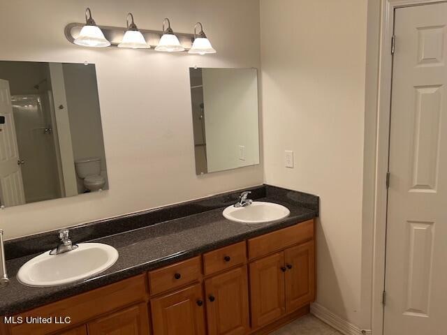 bathroom with vanity and toilet