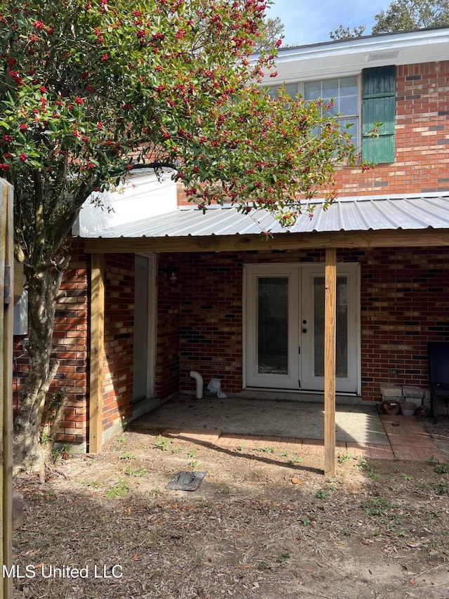 rear view of property with a patio and french doors