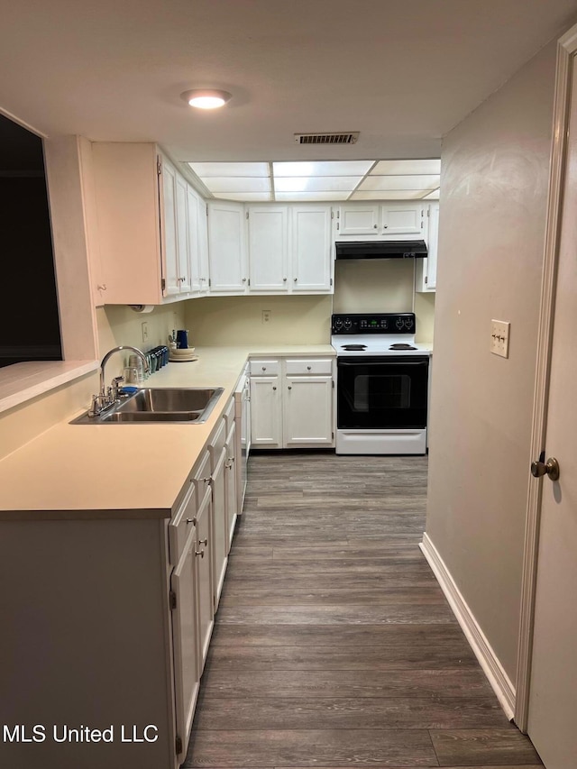 kitchen featuring range with electric stovetop, sink, white cabinets, and dark hardwood / wood-style flooring