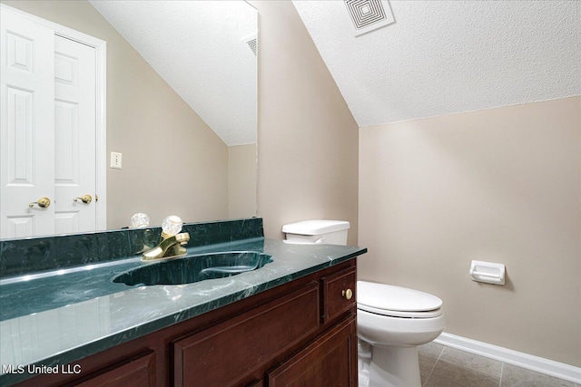 6923 Silver Cloud Cv, Olive Branch, MS 38654 - half bathroom featuring lofted ceiling, vanity, a textured ceiling, and tile patterned flooring