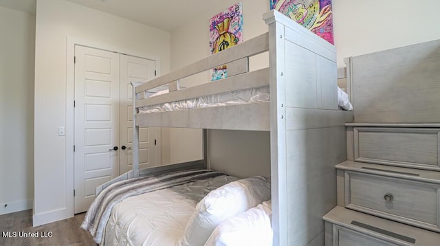 132 Markham Dr, Gulfport, MS 39507 - bedroom featuring wood finished floors, a closet, and baseboards