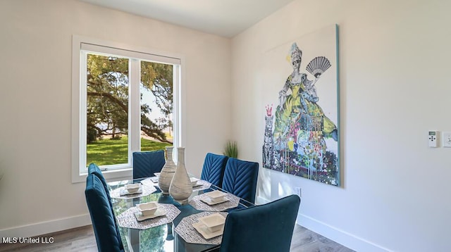 132 Markham Dr, Gulfport, MS 39507 - dining room with baseboards and wood finished floors