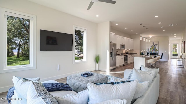 132 Markham Dr, Gulfport, MS 39507 - living area featuring recessed lighting, wood finished floors, baseboards, a ceiling fan, and a chandelier