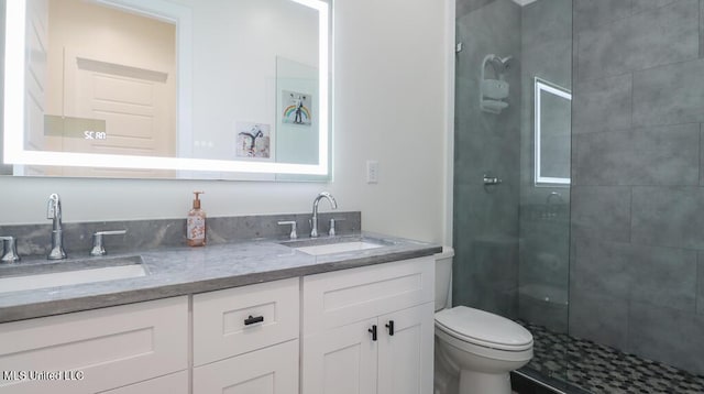132 Markham Dr, Gulfport, MS 39507 - bathroom with a shower stall, double vanity, and toilet