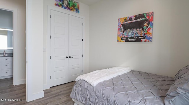 132 Markham Dr, Gulfport, MS 39507 - bedroom featuring a closet and wood finished floors