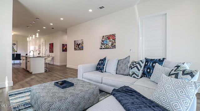 132 Markham Dr, Gulfport, MS 39507 - living room with wood finished floors, baseboards, and recessed lighting