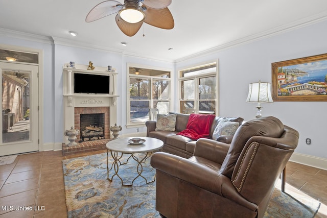 tiled living room with crown molding, ceiling fan, and a brick fireplace