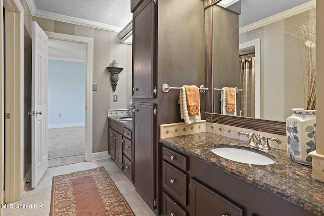 bathroom featuring tile patterned floors, vanity, and ornamental molding