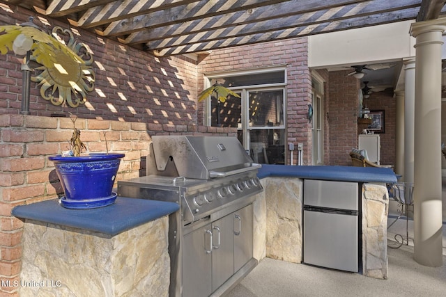 view of patio / terrace featuring an outdoor kitchen and area for grilling