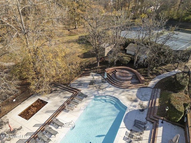 view of swimming pool with a patio