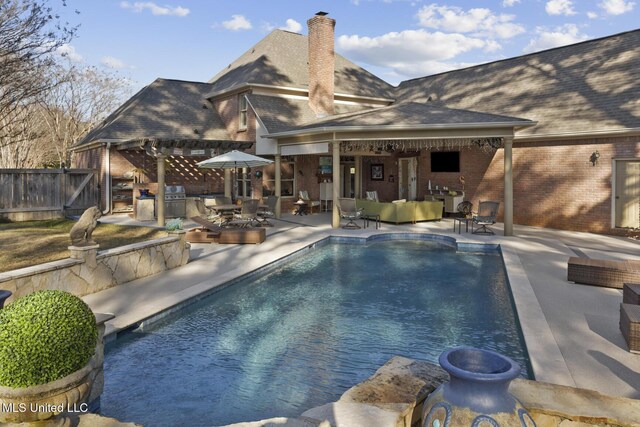 view of swimming pool with an outdoor living space, area for grilling, and a patio