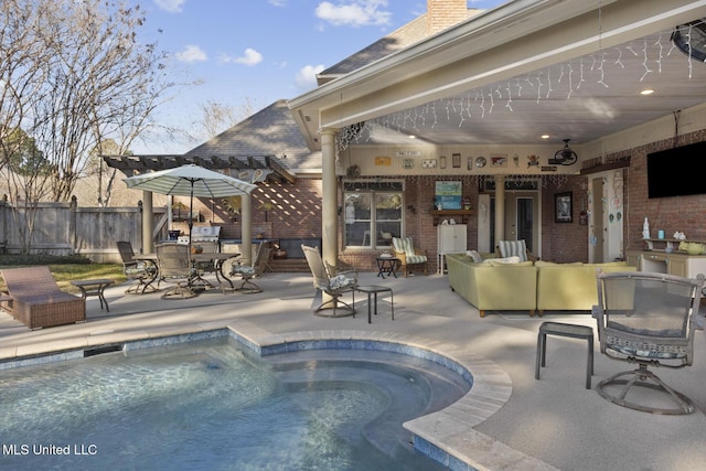 view of pool with an outdoor living space and a patio