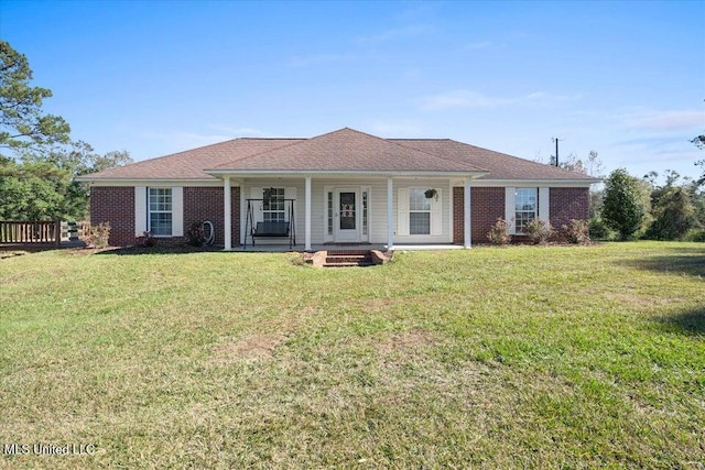 single story home with a porch and a front lawn